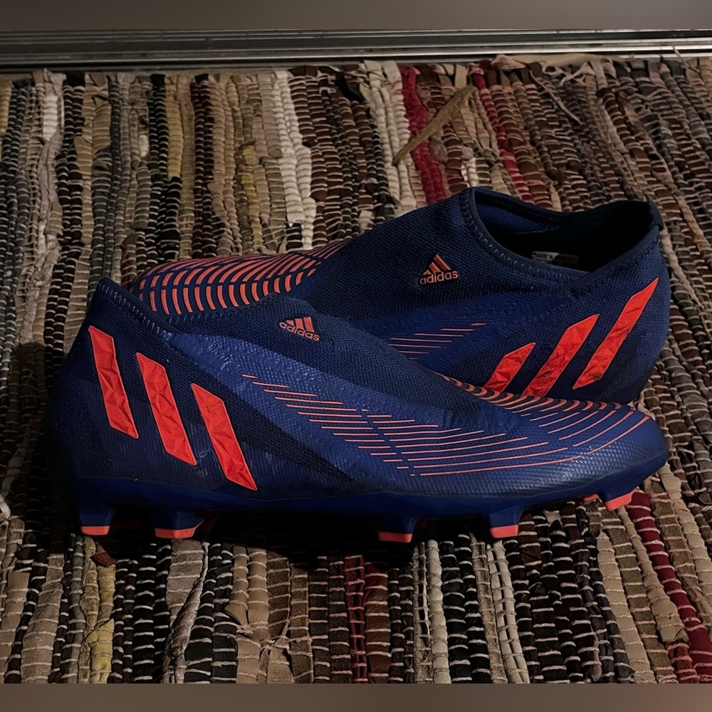 Blue and orange adidas soccer cleats.